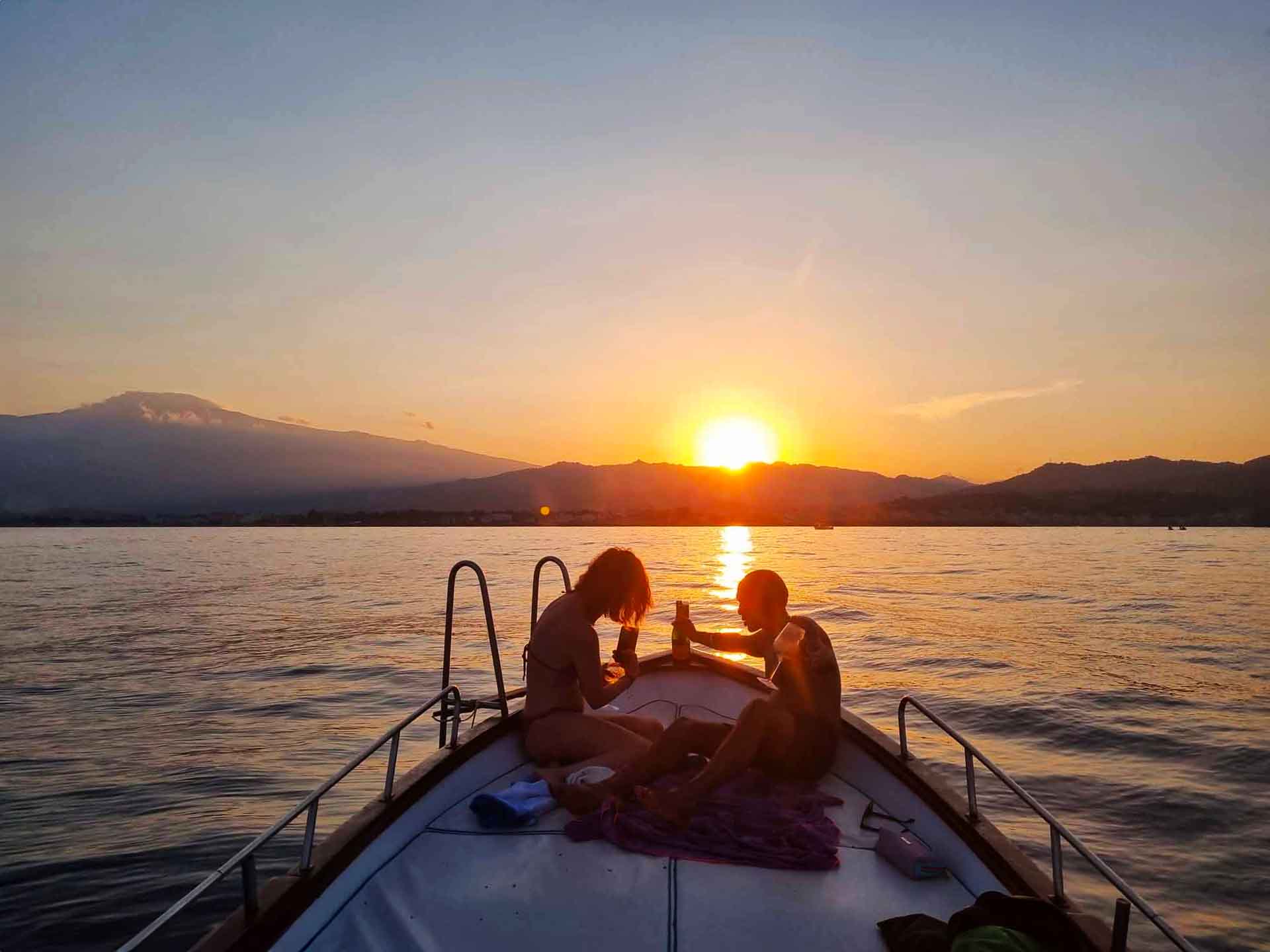Sicilian aperitif served on board at sunset off Taormina