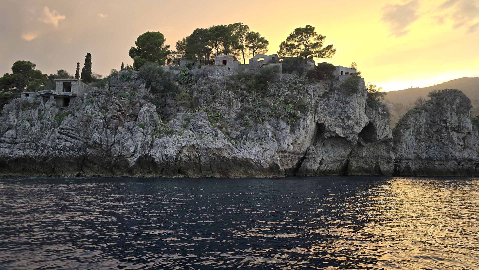 Mount Etna on the horizon from a Taormina sunset boat tour