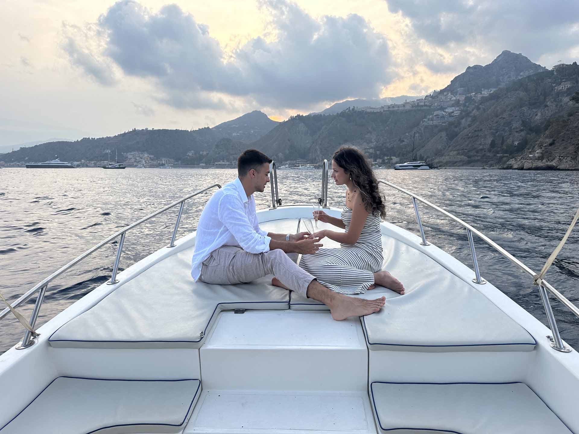 Private sunset boat tour sailing the Taormina coast at dusk