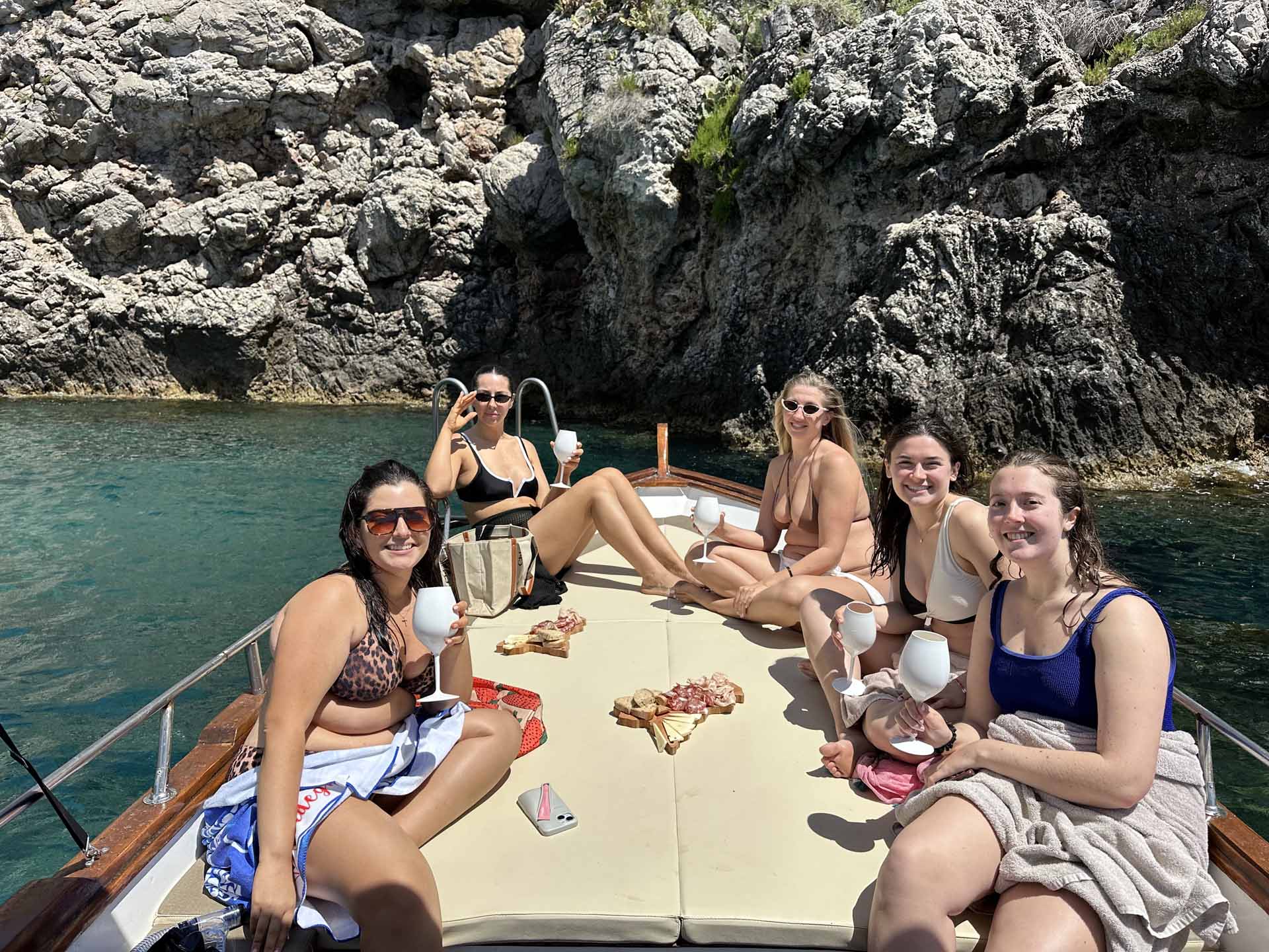 Guests toasting with Sicilian wine on the Taormina boat tour