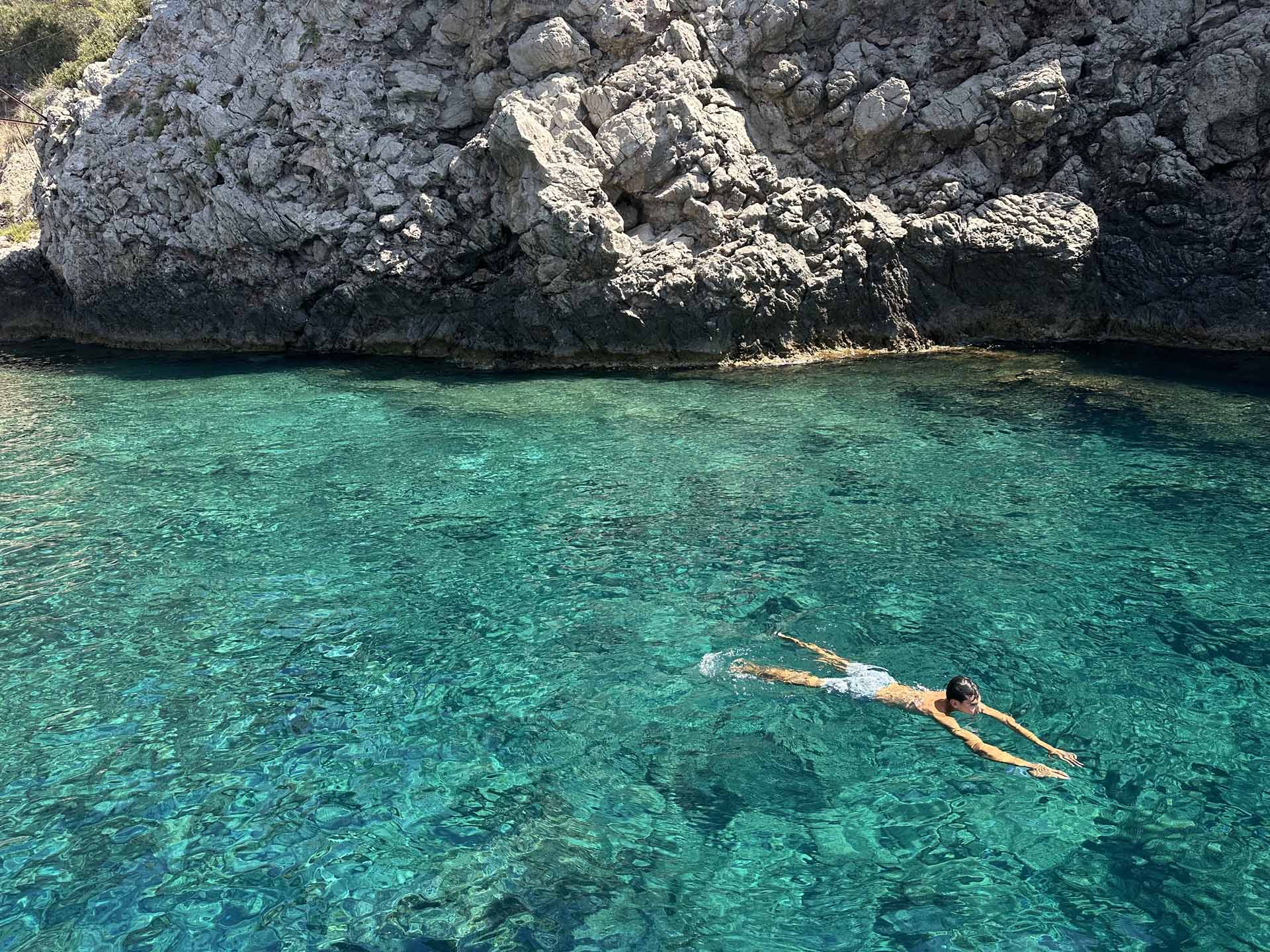 Crystal-clear sea along the Taormina coast