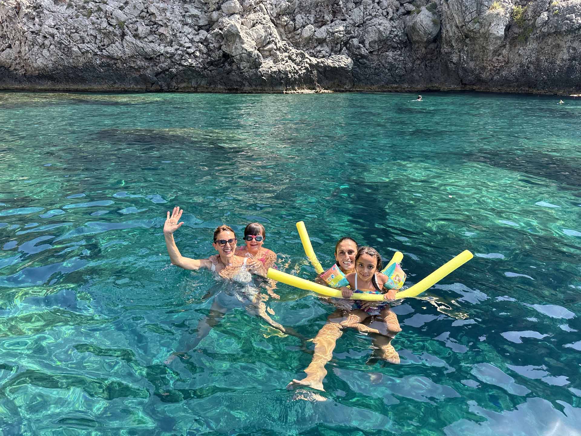 Secluded cove along the Taormina coast reached by boat