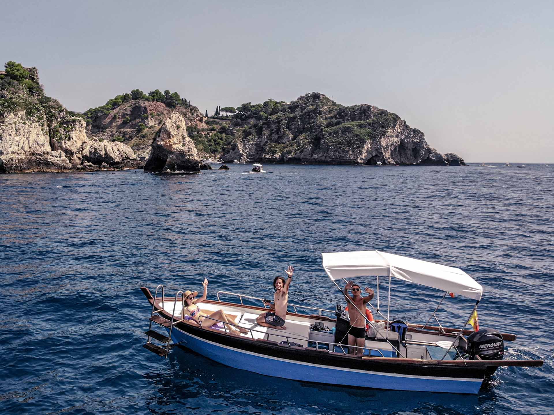 Snorkeller exploring the emerald seabed off Taormina